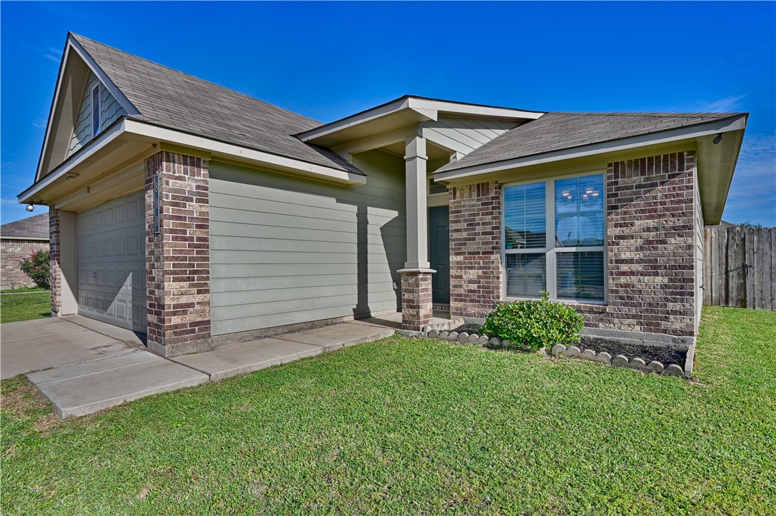 808 Mockingbird Street Navasota, TX 77868 - Photo 3 of 19 a front view of a house with a yard