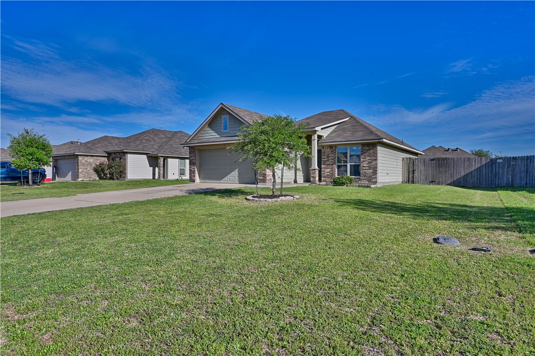 808 Mockingbird Street Navasota, TX 77868 - Photo 4 of 19 a front view of a house with a yard