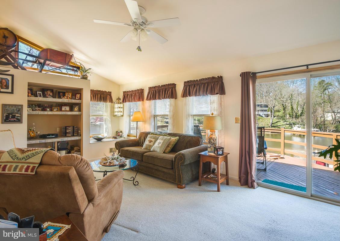 8368 Country Life Road Pasadena, MD 21122 - Photo 8 of 24 Living Room with Slider to Deck