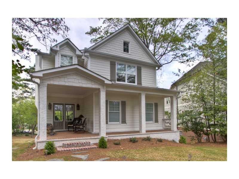 3596 Habersham Road Northwest Atlanta, GA 30305 - Photo 1 of 1 a front view of a house with a yard