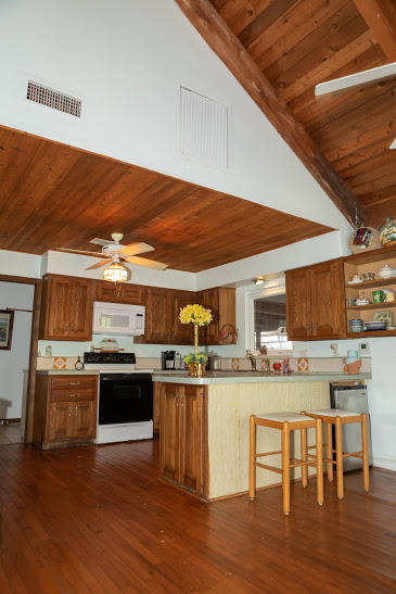 7169 Southeast Rivers Edge Street Jupiter, FL 33458 - Photo 12 of 39 a kitchen with stainless steel appliances granite countertop a stove and cabinets