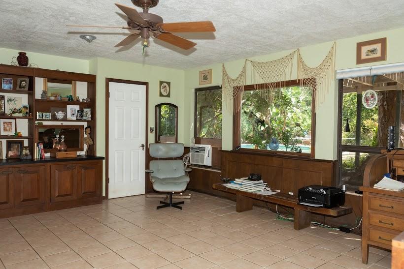 7169 Southeast Rivers Edge Street Jupiter, FL 33458 - Photo 23 of 39 a living room with furniture a window and a chandelier