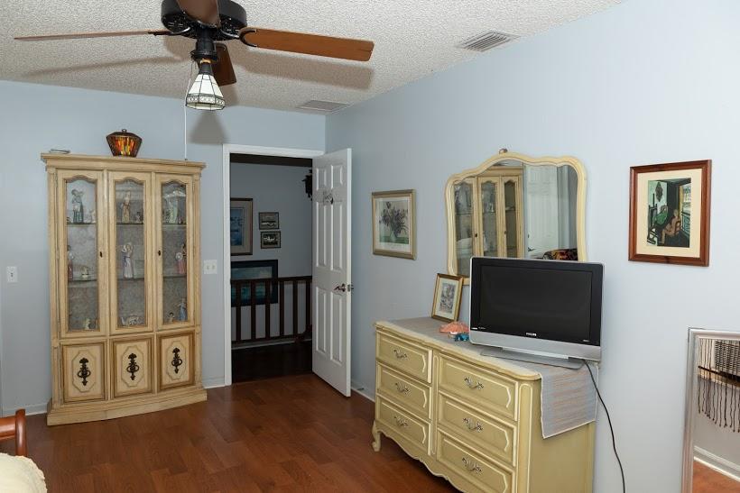 7169 Southeast Rivers Edge Street Jupiter, FL 33458 - Photo 27 of 39 a living room with furniture and a flat screen tv