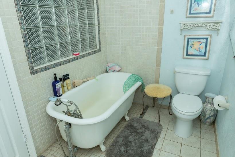7169 Southeast Rivers Edge Street Jupiter, FL 33458 - Photo 30 of 39 a bathroom with a sink and a toilet