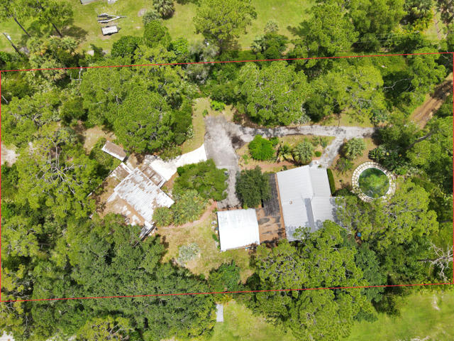 7169 Southeast Rivers Edge Street Jupiter, FL 33458 - Photo 35 of 39 an aerial view of a house with a yard