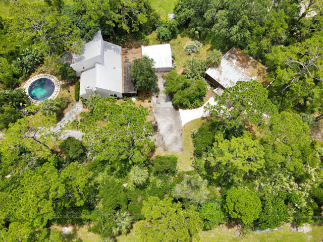 7169 Southeast Rivers Edge Street Jupiter, FL 33458 - Photo 36 of 39 an aerial view of a house with a yard and swimming pool