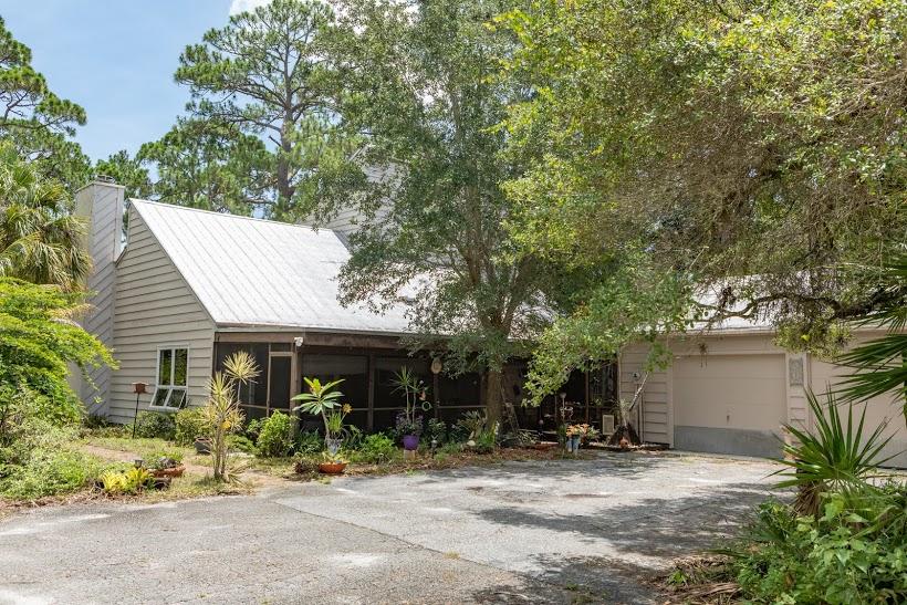7169 Southeast Rivers Edge Street Jupiter, FL 33458 - Photo 7 of 39 a front view of a house with a sitting area
