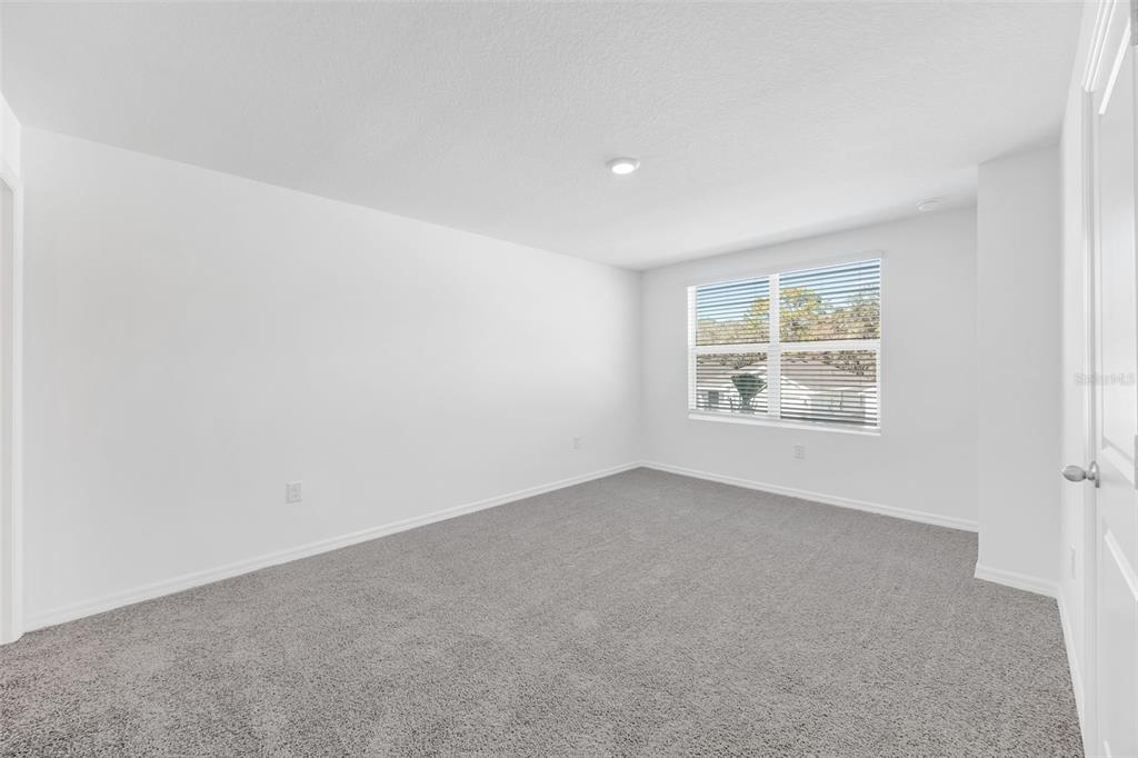 1011 Spotted Egret Loop Ruskin, FL 33570 - Photo 15 of 33 an empty room with windows