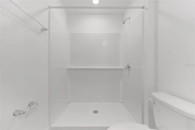 a view of a livingroom and a bathroom