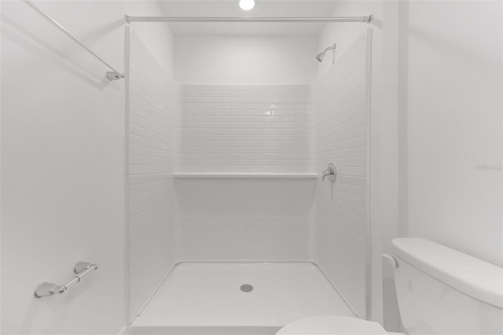 1011 Spotted Egret Loop Ruskin, FL 33570 - Photo 19 of 33 a bathroom with a shower