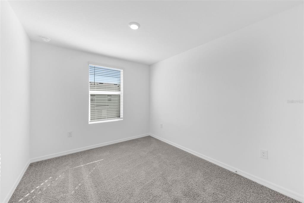 1011 Spotted Egret Loop Ruskin, FL 33570 - Photo 23 of 33 an empty room with a window