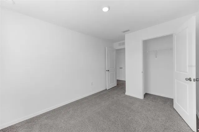 a view of empty room with storage