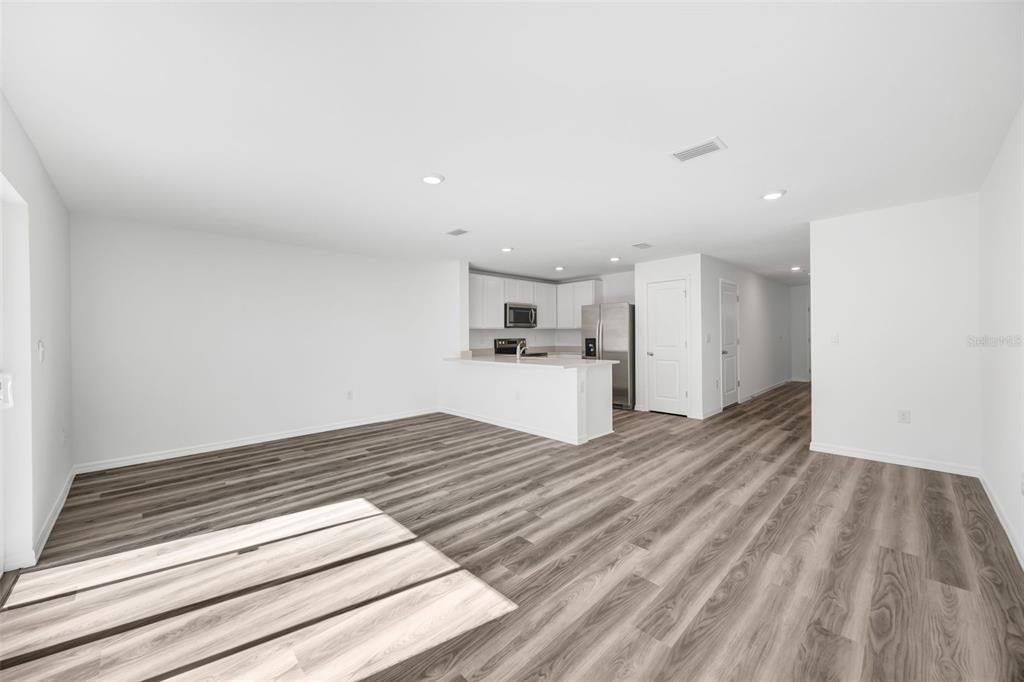 1011 Spotted Egret Loop Ruskin, FL 33570 - Photo 10 of 33 a view of kitchen and empty room