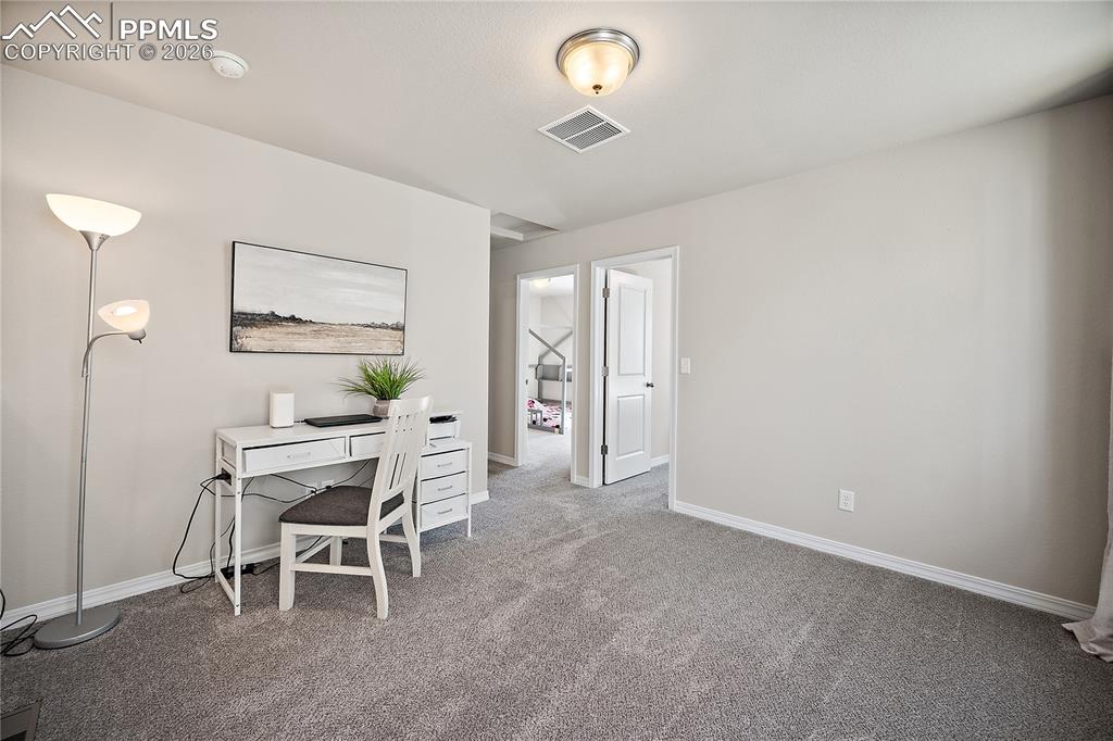 4295 Samaritan Loop Colorado Springs, CO 80916 - Photo 17 of 50 a view of a dining room with furniture