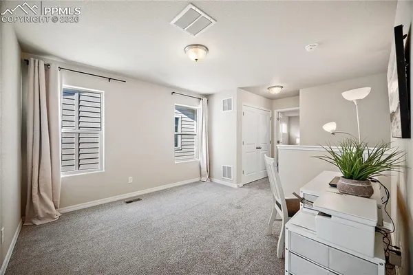 a view of livingroom with furniture and window
