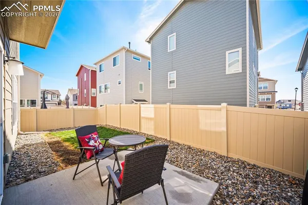a balcony view with a granite countertop coffee table and chairs