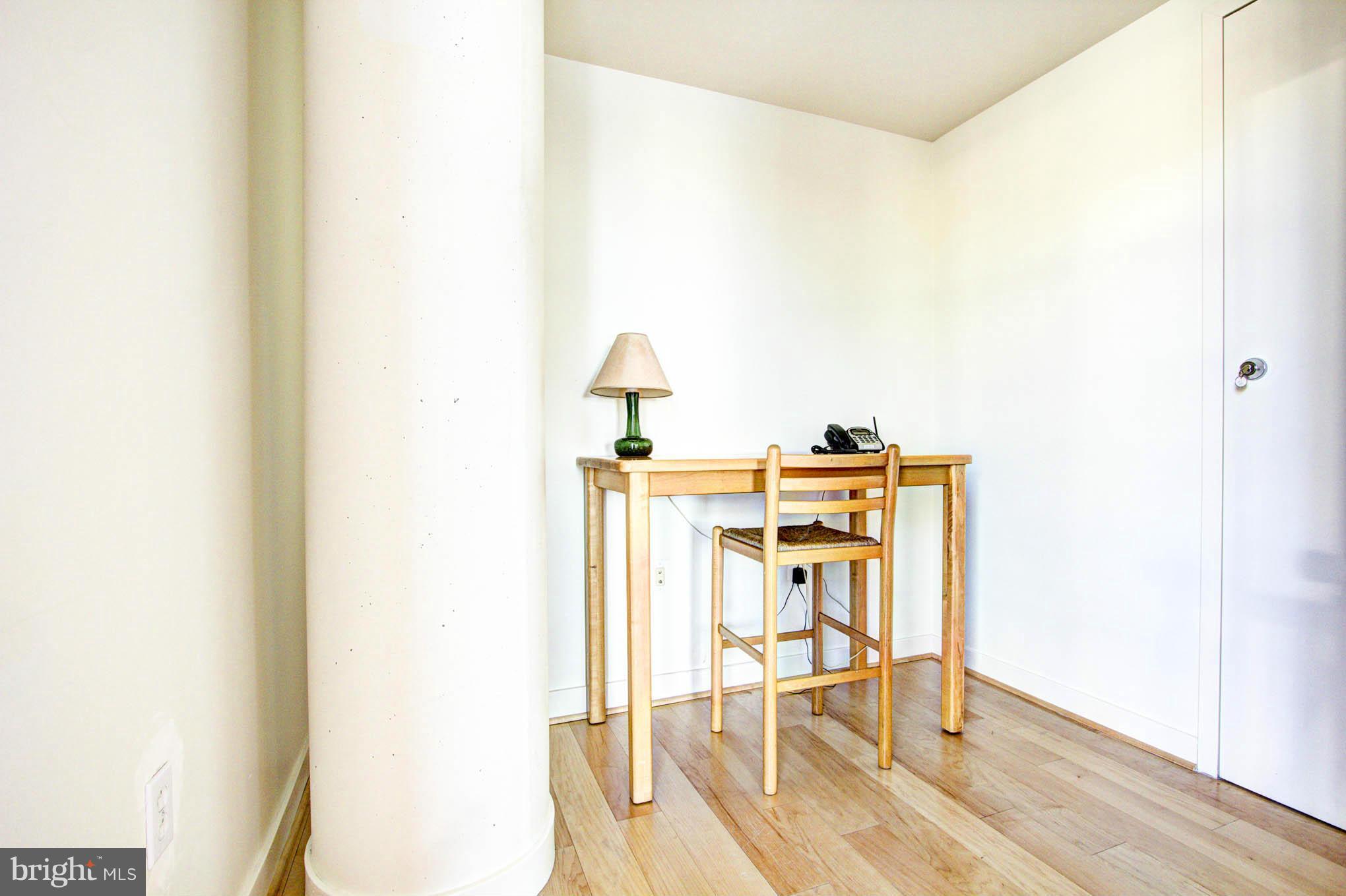 12025 New Dominion Parkway, Unit LL103 Reston, VA 20190 - Photo 17 of 30 a workspace with furniture and wooden floor