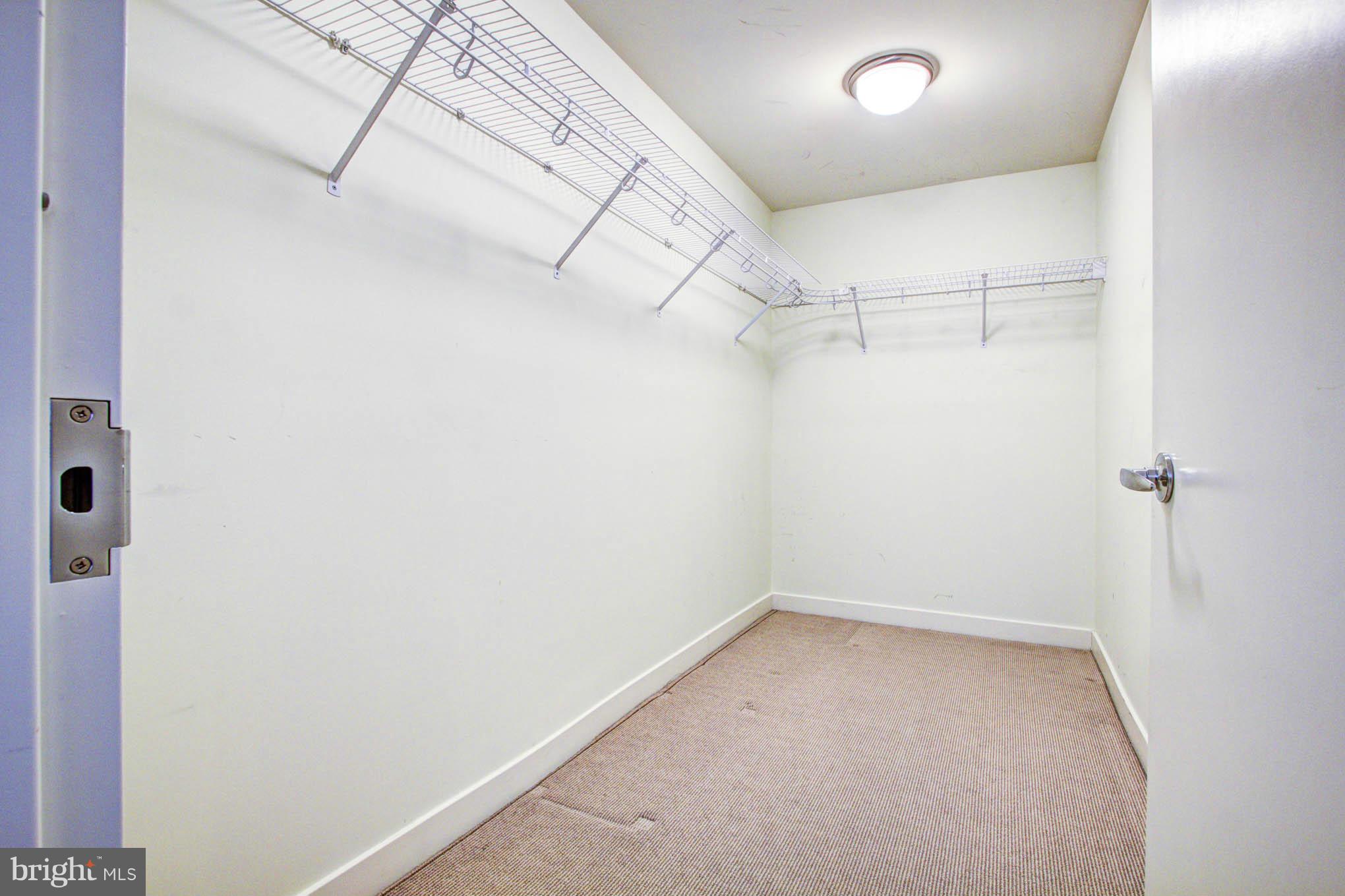 12025 New Dominion Parkway, Unit LL103 Reston, VA 20190 - Photo 21 of 30 a view of a room with racks on the wall