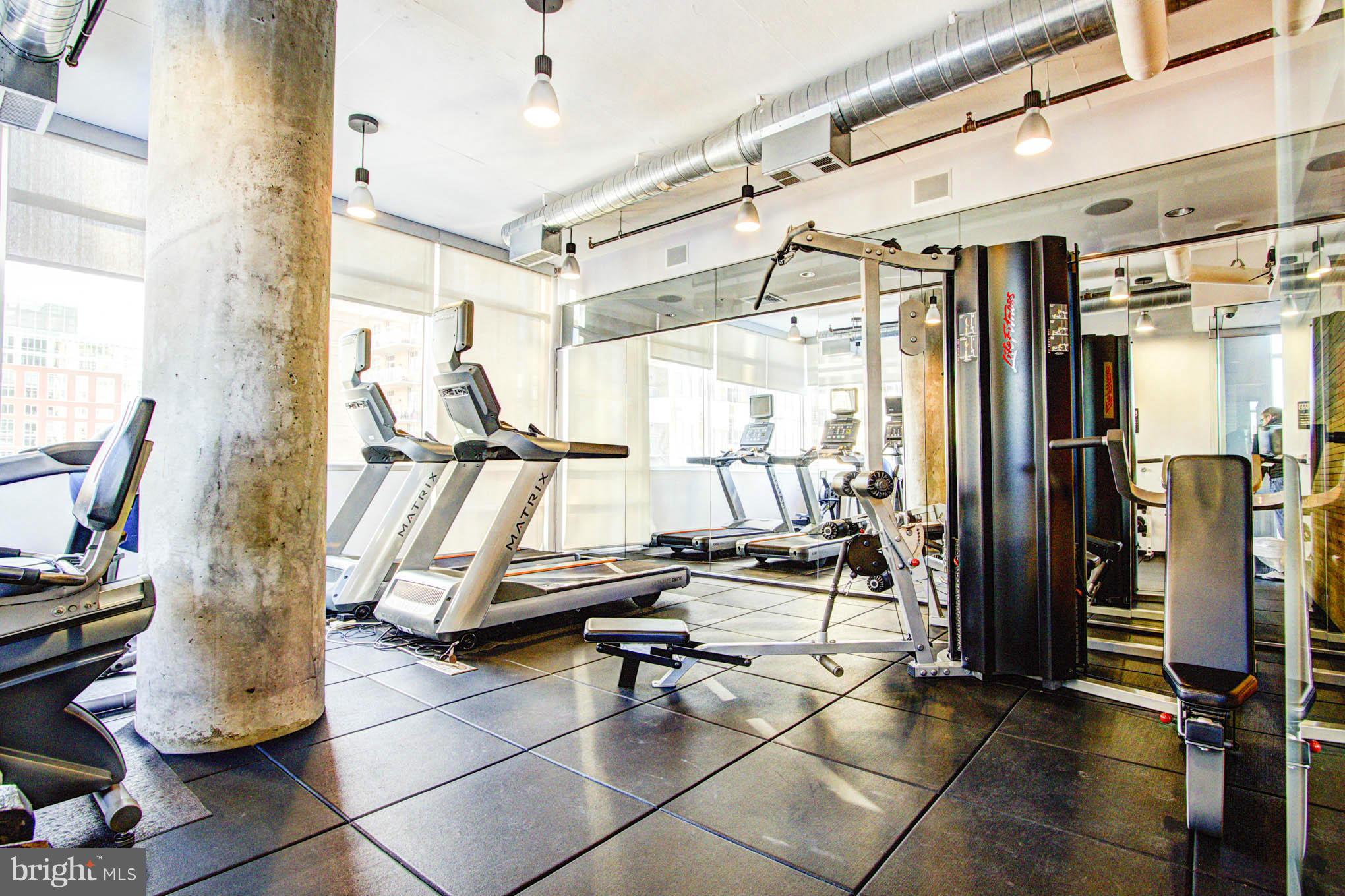 12025 New Dominion Parkway, Unit LL103 Reston, VA 20190 - Photo 23 of 30 a gym hall with exercise machine