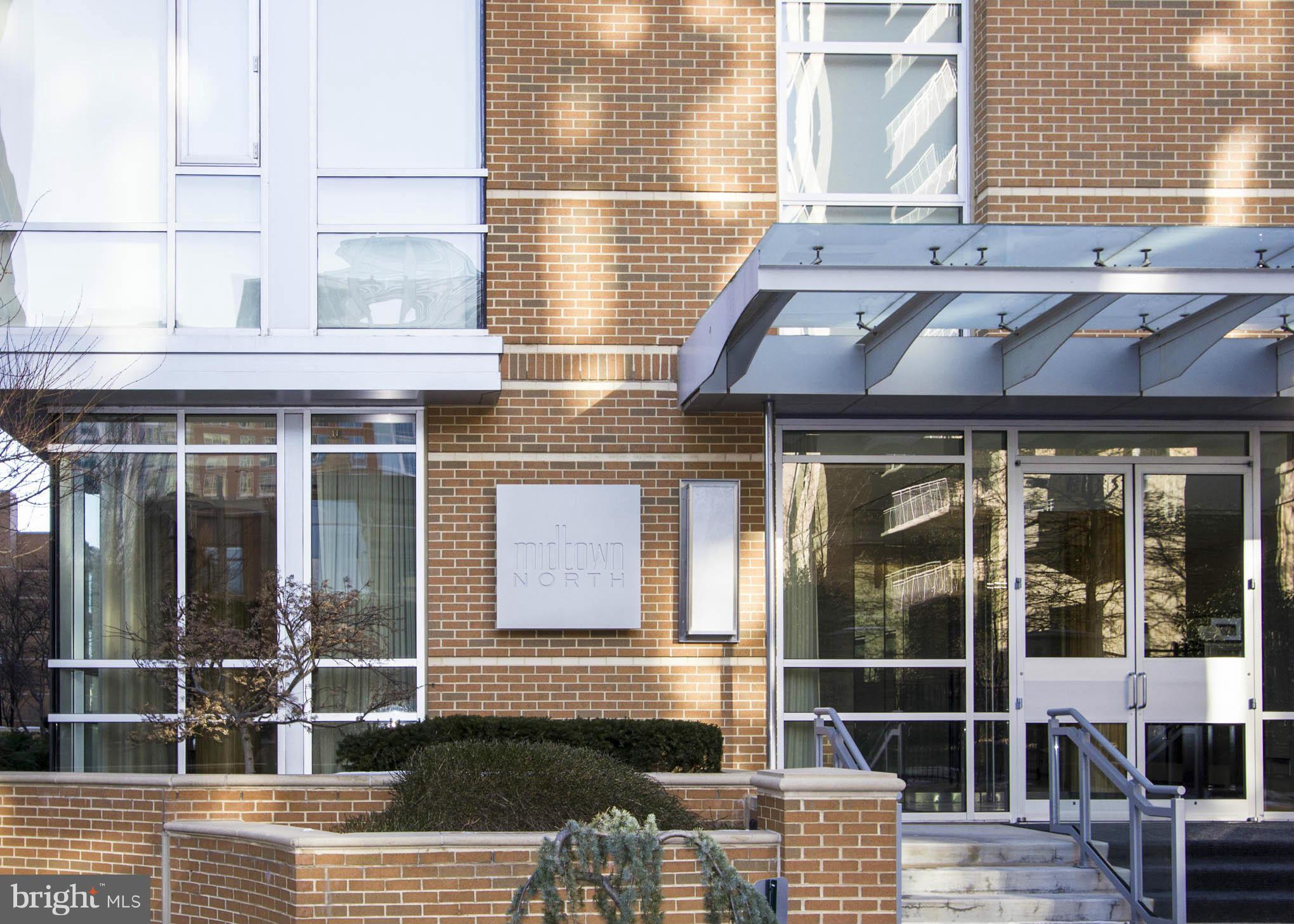 12025 New Dominion Parkway, Unit LL103 Reston, VA 20190 - Photo 27 of 30 a view of a building with a door and deck