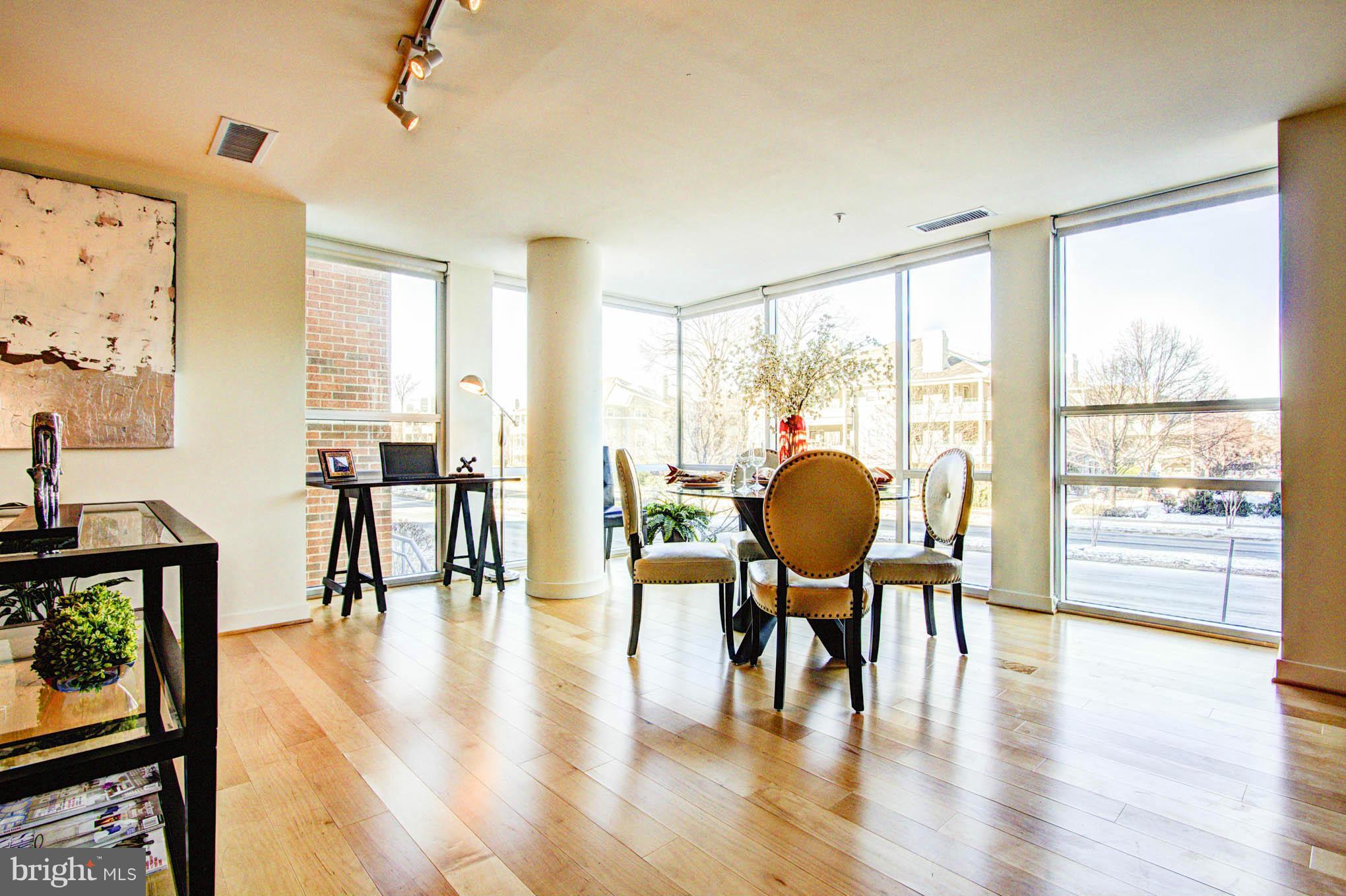 12025 New Dominion Parkway, Unit LL103 Reston, VA 20190 - Photo 9 of 30 a view of a livingroom with furniture window and wooden floor