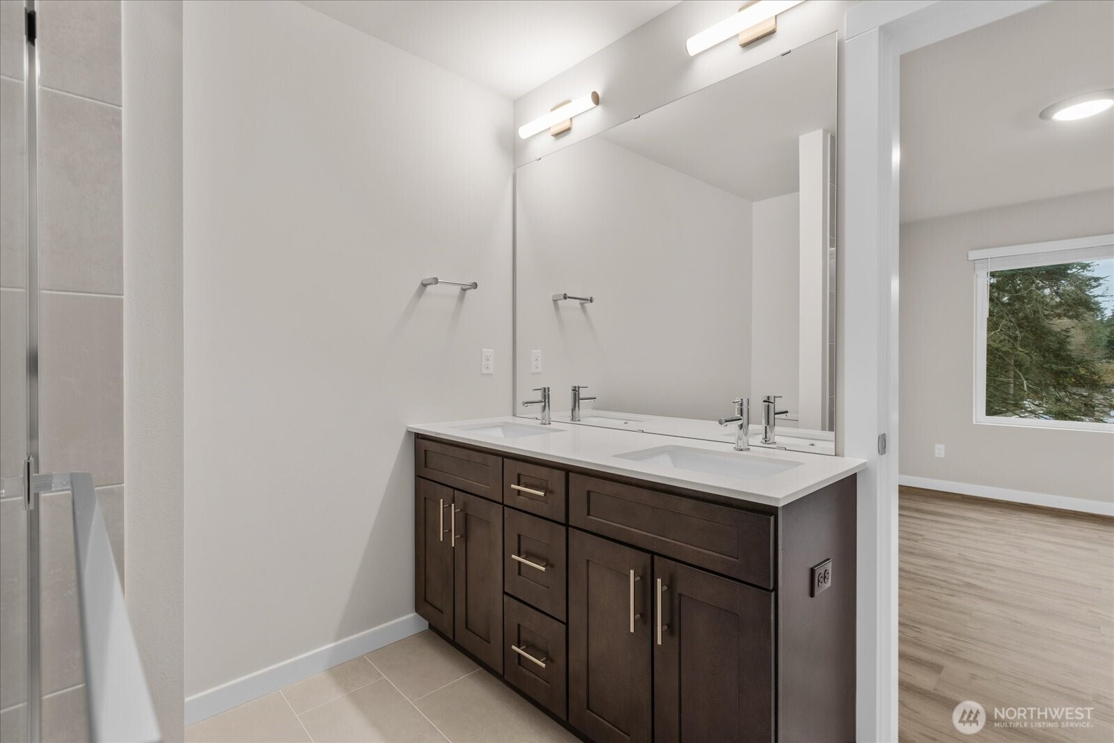 23413 Edmonds Way, Unit A2 Edmonds, WA 98026 - Photo 22 of 40 a bathroom with a sink a mirror and a shower