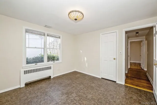 a view of an empty room and window