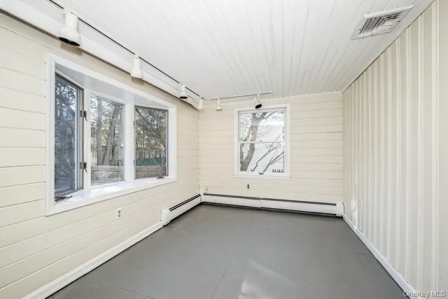 a view of an empty room with a window