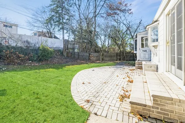 a view of a swimming pool with a patio