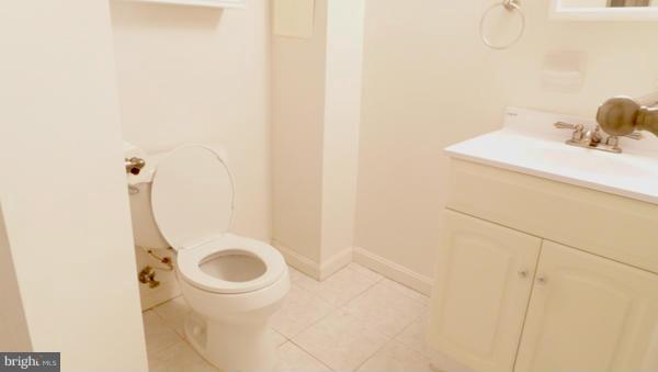 12311 Goodhill Road Silver Spring, MD 20902 - Photo 11 of 20 a bathroom with a sink and a washing machine