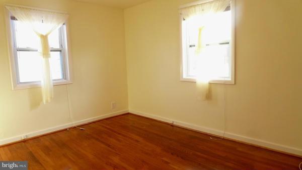 12311 Goodhill Road Silver Spring, MD 20902 - Photo 3 of 20 a view of a small space with wooden floor and a window