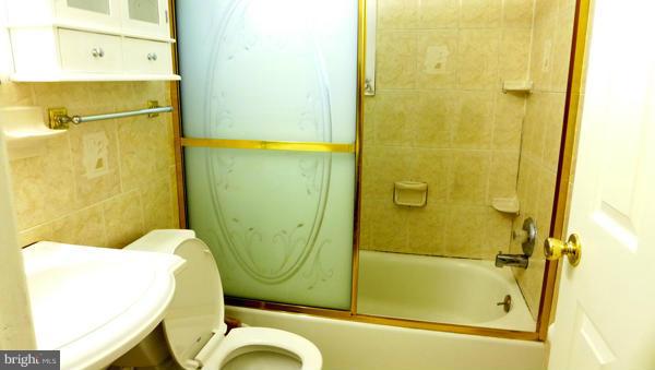 12311 Goodhill Road Silver Spring, MD 20902 - Photo 5 of 20 a bathroom with a sink and shower