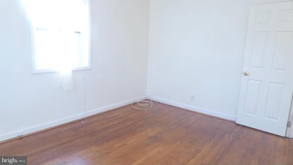12311 Goodhill Road Silver Spring, MD 20902 - Photo 6 of 20 a view of an empty room and wooden floor