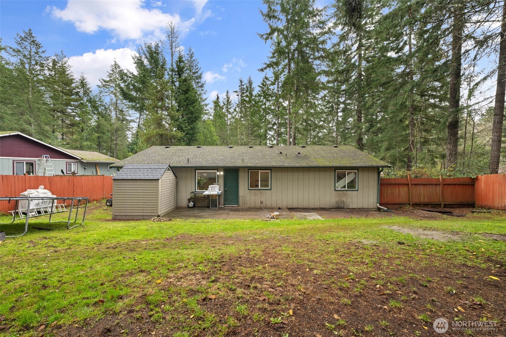 71 East Dunvegan Road Shelton, WA 98584 - Photo 13 of 21 a view of a house with a yard and large tree