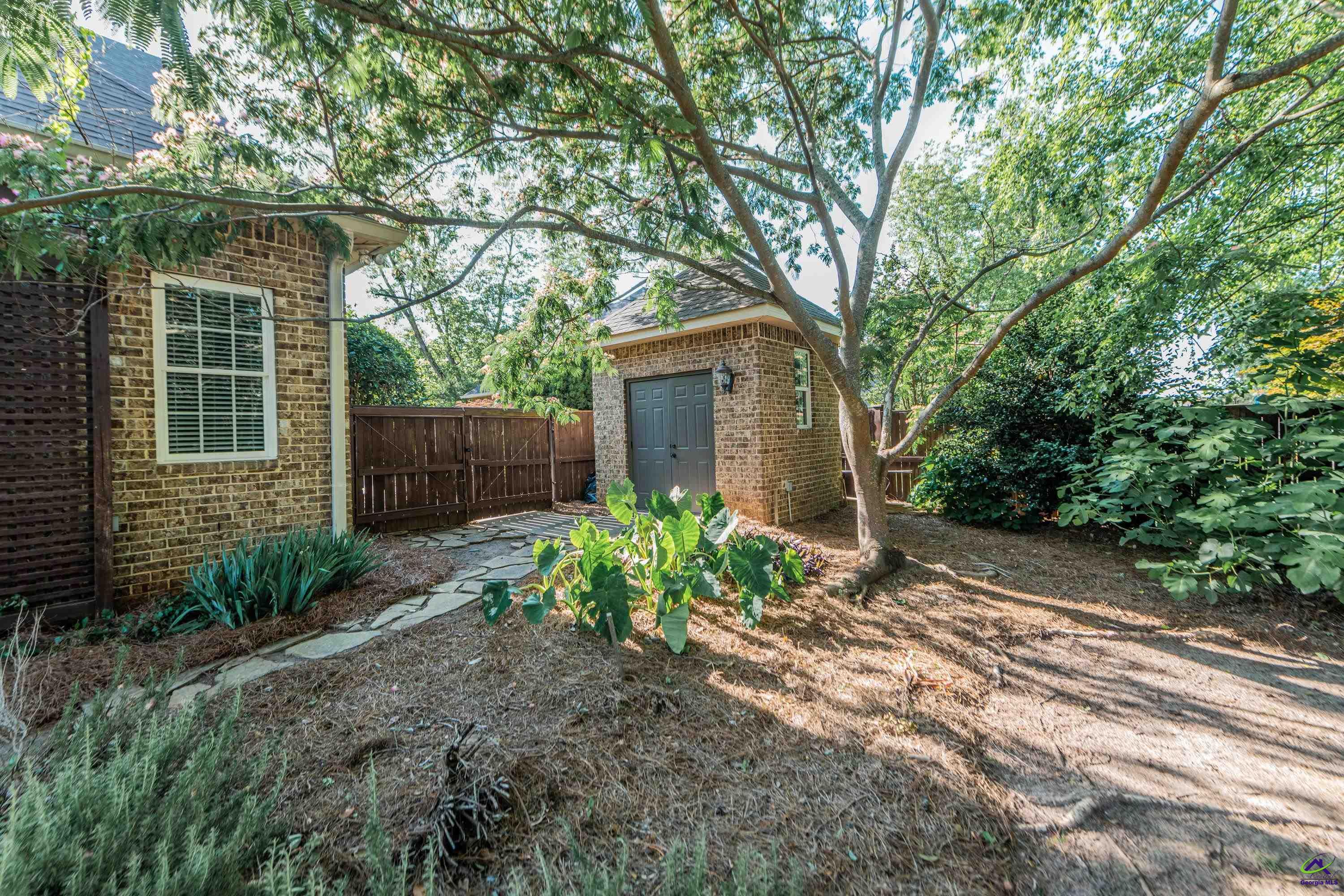 405 Old Bridge Road Warner Robins, GA 31088 - Photo 55 of 58 a view of a house with a yard and plants