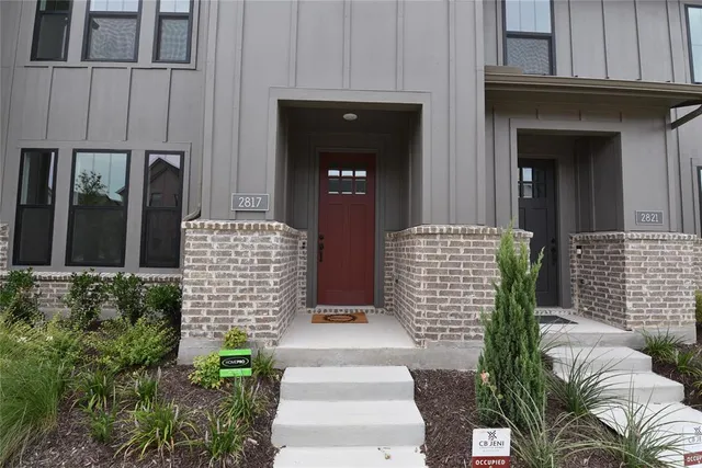a front view of a house with a porch