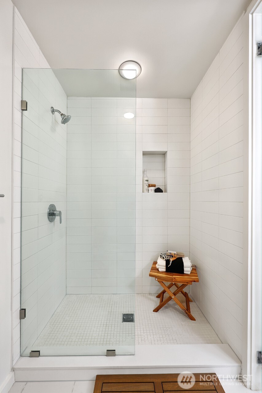 2547 Northeast 83rd Street Seattle, WA 98115 - Photo 28 of 38 a bathroom with a sink and a mirror