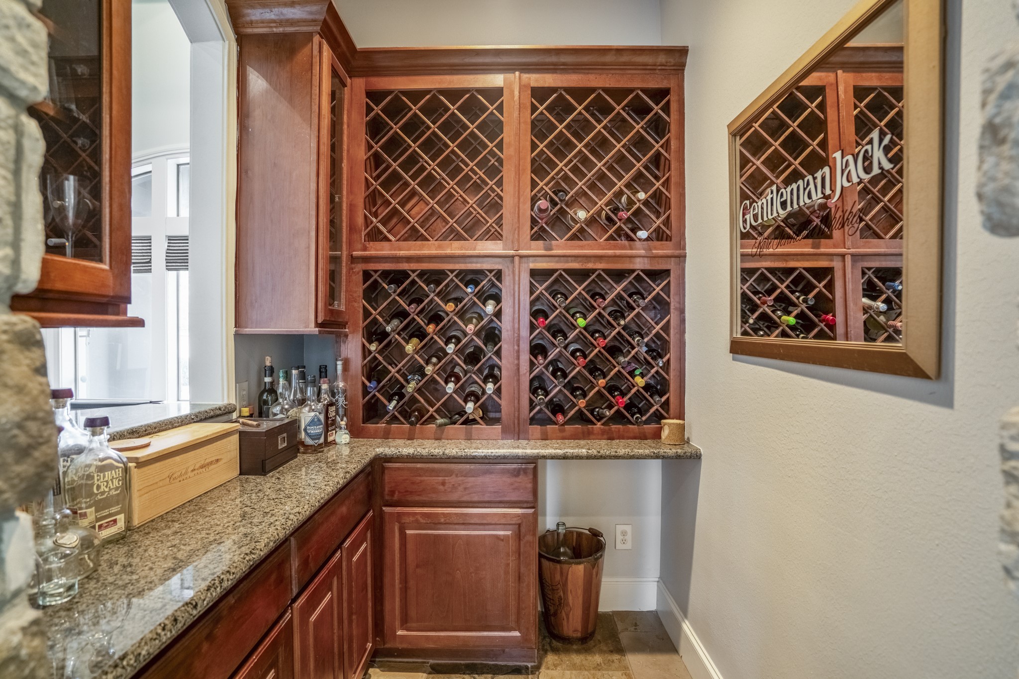 25606 Windy Isle Court Spring, TX 77389 - Photo 14 of 45 What a great conversation starter, rich wood custom built wine storage in the wine grotto offers an easy entertainment station.