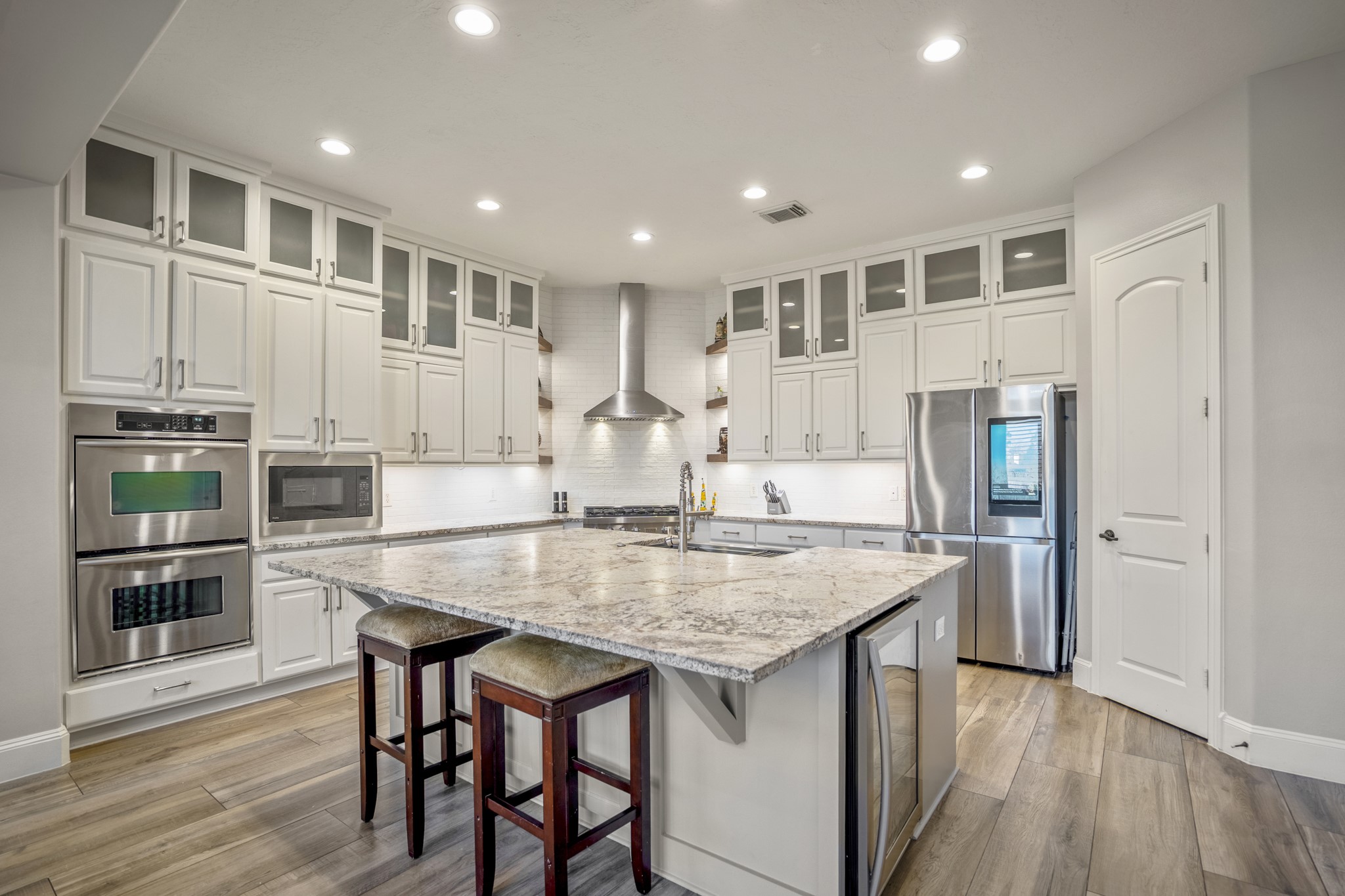 25606 Windy Isle Court Spring, TX 77389 - Photo 20 of 45 From the under-cabinet lighting to the floating corner shelves for displaying your favorite cookbooks or decor, every inch is designed to be as functional as it is beautiful.