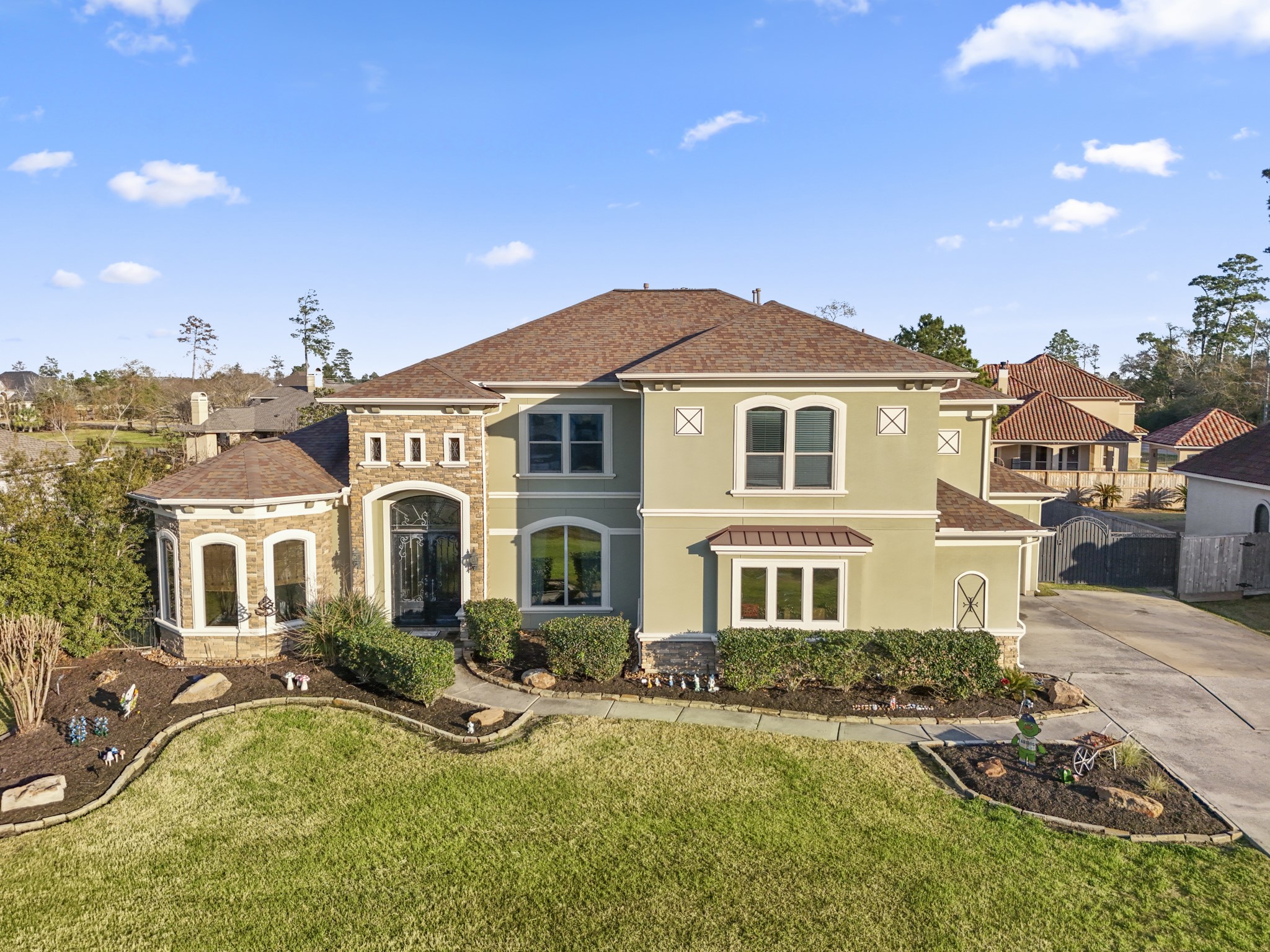 25606 Windy Isle Court Spring, TX 77389 - Photo 2 of 45 a front view of a house with yard and green space