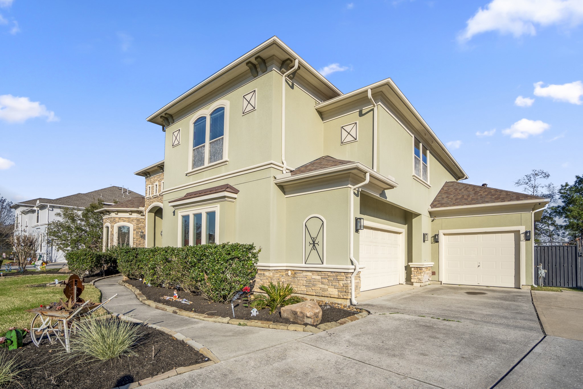 25606 Windy Isle Court Spring, TX 77389 - Photo 3 of 45 a view of a white house with a outdoor space