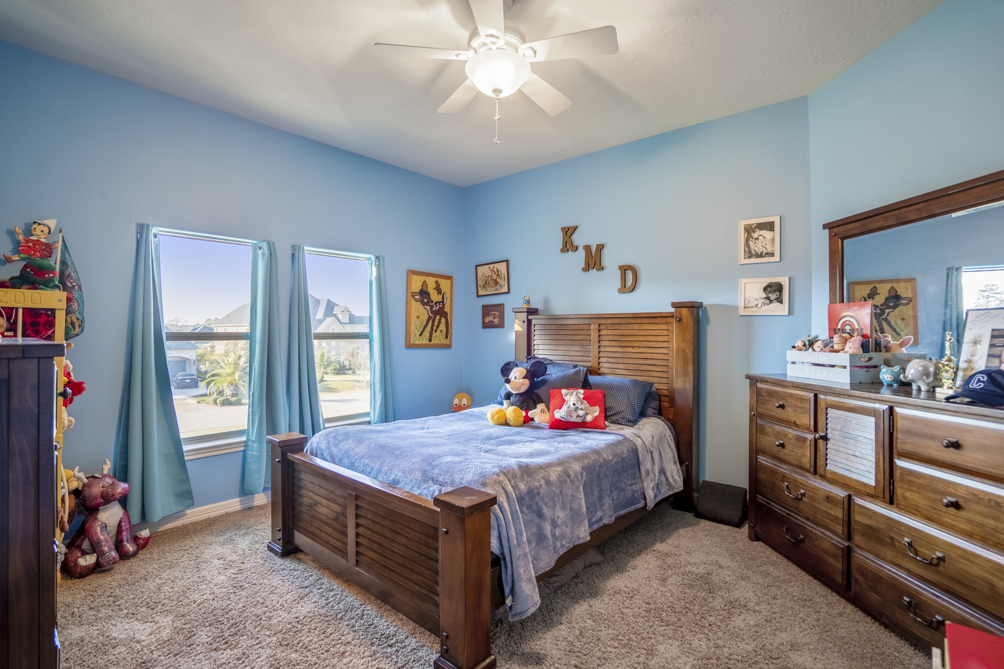 25606 Windy Isle Court Spring, TX 77389 - Photo 31 of 45 a bedroom with a bed and a dresser in it