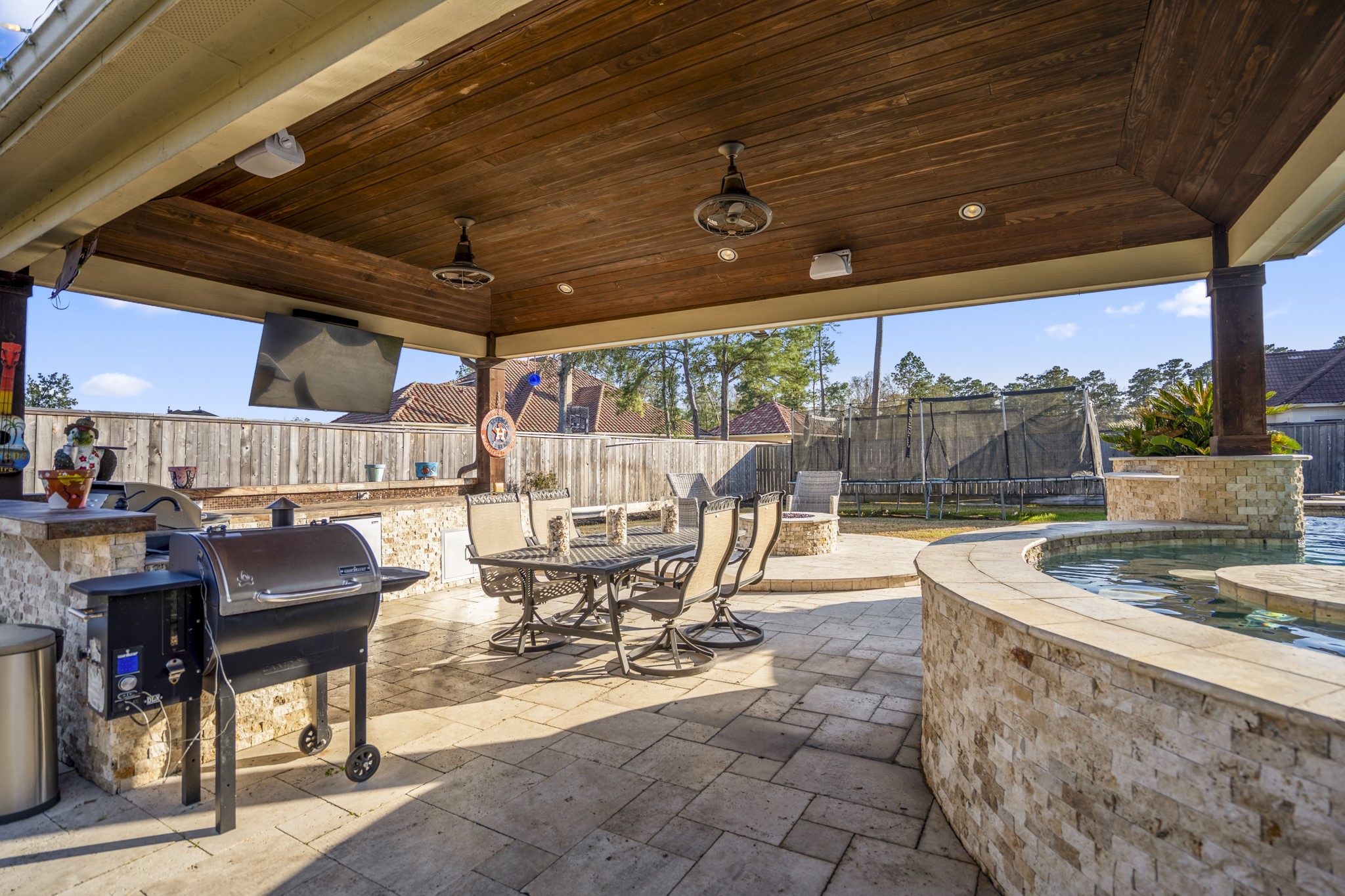 25606 Windy Isle Court Spring, TX 77389 - Photo 37 of 45 This private backyard resort-style oasis designed for high-impact entertaining and everyday relaxation, with full summer kitchen, anchored by a stunning pool, the space offers a seamless blend of luxury and functionality.