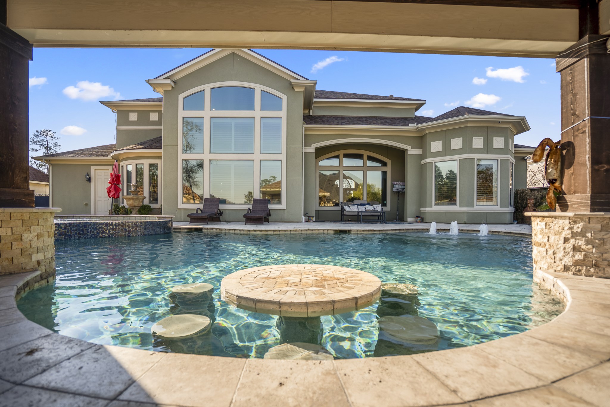 25606 Windy Isle Court Spring, TX 77389 - Photo 38 of 45 Fun in the summer just took on a new meaning, with this special in bar seating configuration, that allows you to enjoy your outdoor sanctuary that feels like a truly secluded getaway!