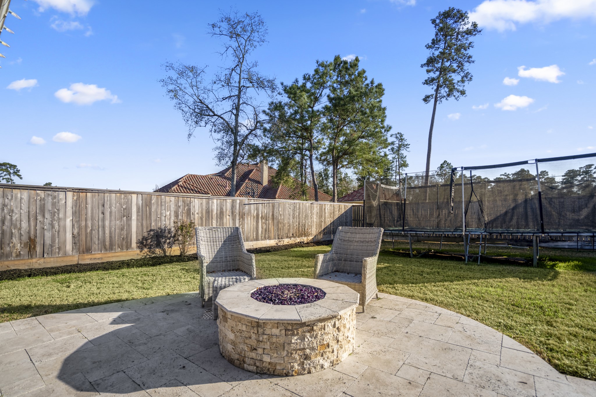25606 Windy Isle Court Spring, TX 77389 - Photo 39 of 45 a backyard of a house with barbeque oven fire pit and outdoor seating