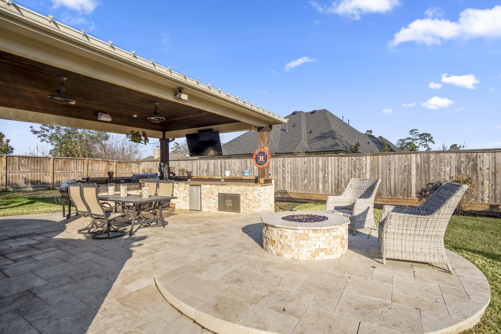 25606 Windy Isle Court Spring, TX 77389 - Photo 40 of 45 a view of a patio with table and chairs with wooden floor and fence