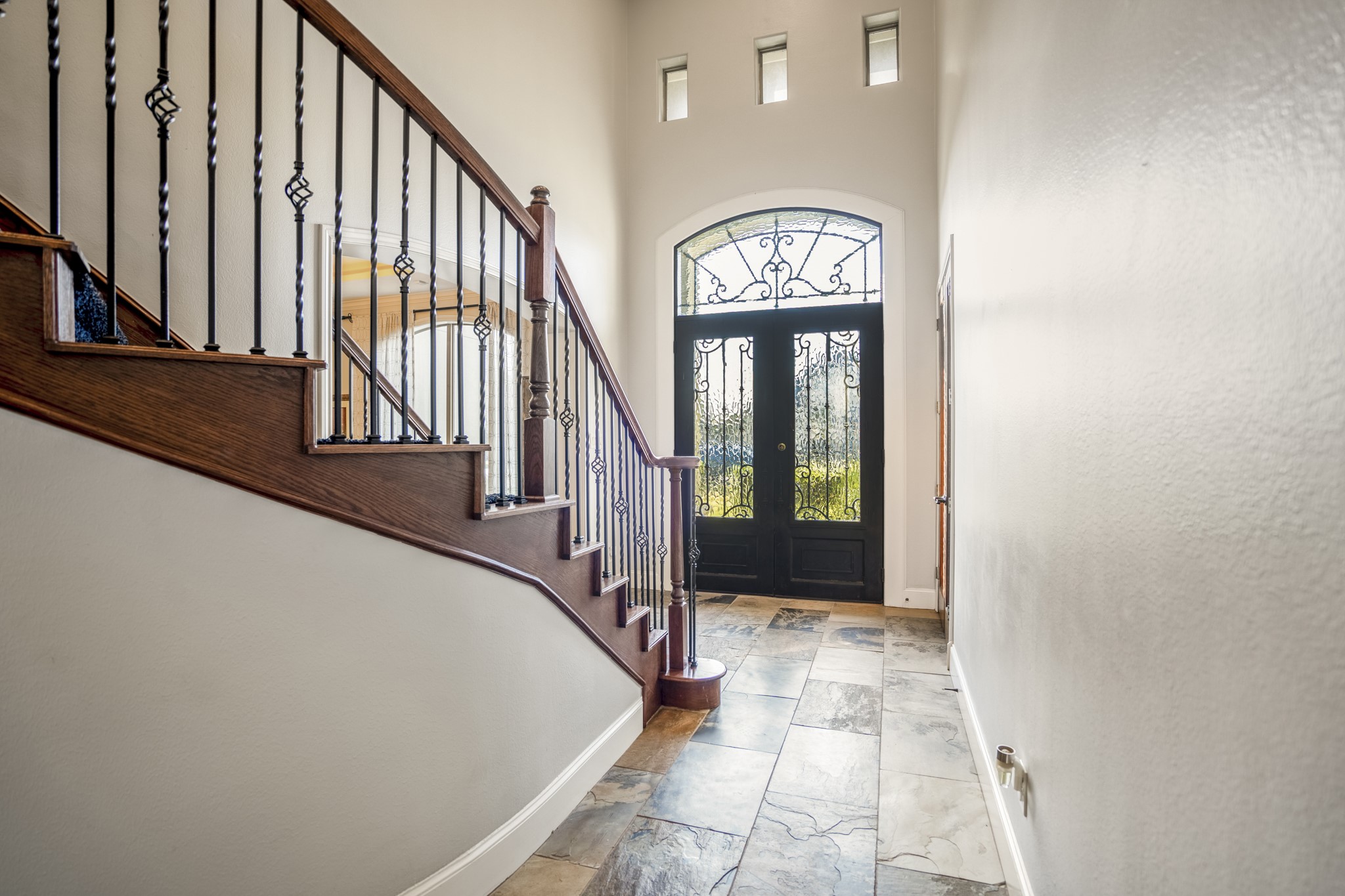 25606 Windy Isle Court Spring, TX 77389 - Photo 7 of 45 Welcome you guests to your new home in this large foyer offering lots of natural light that streams through the majestic wrought iron front doors.