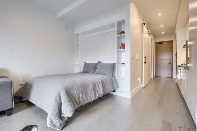 a bedroom with a bed and a view of bathroom