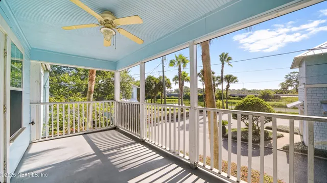 a view of a balcony with furniture