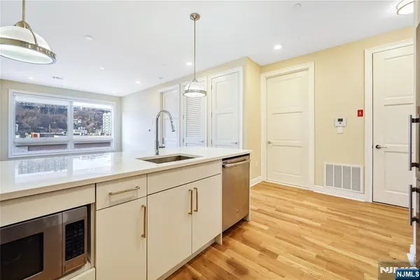 a spacious bathroom with a granite countertop sink mirror and